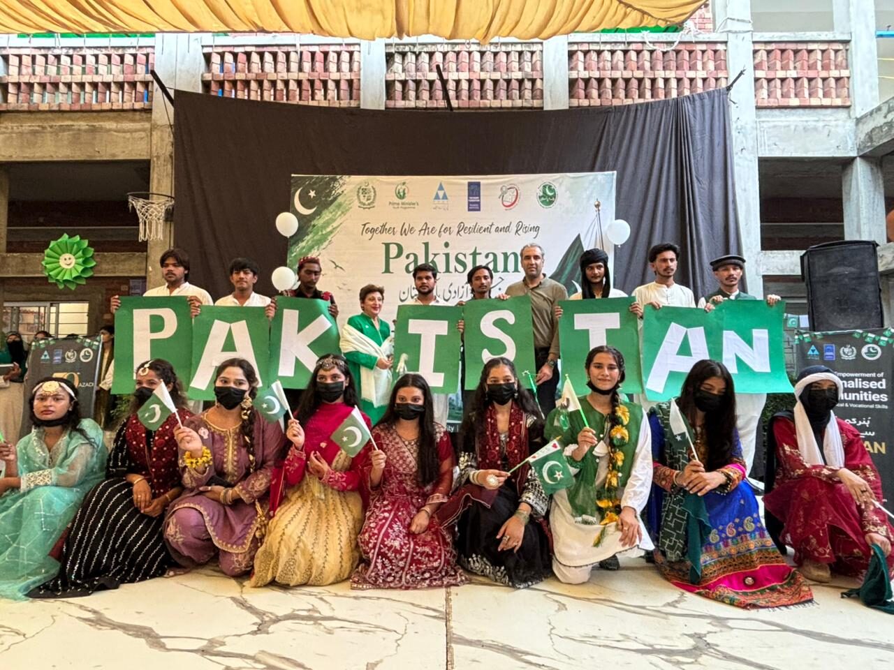 Hunar students spell out PAKISTAN on stage on Independence Day